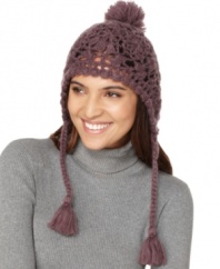 DIY-inspired style from American Rag. With its dangling pom poms, you'll look adorably chic on the slopes in this crocheted trapper hat.