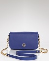 Tory Burch's leather mini bag is a proof that luxe things come in little packages. In a cool hue with chain detailing, this compact packs a sizable punch over an all-black ensemble.