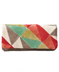 Pretty in patchwork. This eye-catching clutch from Fossil features a front patchwork flap that will add interest to any ensemble.