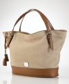A perfect blend of cool, casual cotton canvas and rich leather accents, this roomy and versatile tote from Lauren by Ralph Lauren is an everyday essential infused with haute style.