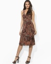 Smooth paisley jersey flatters the body in a feminine A-line silhouette with an elegant cross-wrap neckline.