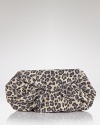 A fierce alternative to basic black: make your look me-ow with Lauren Merkin's leopard clutch. The cat-like compact goes wild with a sleek frock and sky-high heels.