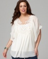 Enjoy your winter escape with Style&co.'s short sleeve plus size peasant top, accented by a crocheted bib.