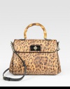 Leopard-printed raffia mixes with bamboo and patent leather accents for an instantly chic flap-top design. Bamboo top handle, 4¼ dropAdjustable detachable patent leather shoulder strap, 18½-21 dropTurnlock flap closureProtective metal feetOne inside zip pocketTwo inside open pocketsFully lined10¼W X 8H X 3DImported