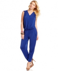 Drape yourself in effortless cool with this jumpsuit from GUESS?. A comfy, slouchy fit and tapered leg makes this one-piece a super stylish look for your vacation or stay-cation!