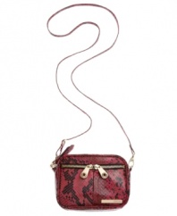 Throw on this casual crossbody and you're out the door. A take-anywhere design from Kenneth Cole Reaction featuring an all-over python print, gold-tone hardware and a unique double zip front pocket.