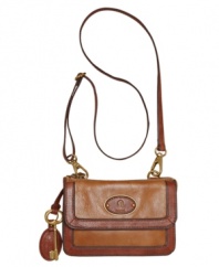 Rich leather and aged goldtone hardware grace this 70's inspired silhouette for gorgeous everyday style. Carry it as a clutch for a night out, or throw on the crossbody strap for a day strolling about the city.