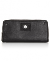Simplistically chic, this genuine leather Calvin Klein wallet features just the right amount of designer detail. A small silvertone turnlock logo graces the wallet while an easy access zip around closure makes it ideal for everyday accessibility.