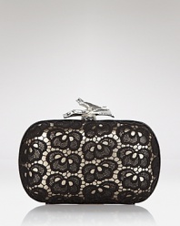 DIANE von FURSTENBERG is sure to make stylish hearts lace with this compact clutch. Just the right size for getting festive, it's a ladylike way to punch up that party dress.