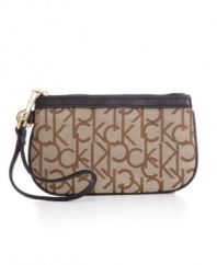 Grab the wristlet purse by Calvin Klein to carry just the essentials or stash within handy reach inside a larger bag.