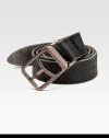 Worn and weathered calfskin leather with an distressed metal logo buckle. About 1¾ wide Made in Italy 