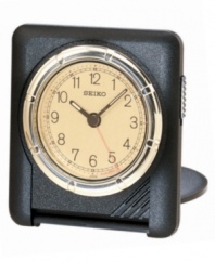 A touch of rustic charm adds style to utmost functionality with this folding, travel-ready clock from Seiko. Ultra-thin black matte square case. Rotating goldtone bezel sets alarm. Round goldtone dial with logo, numeral indices, alarm with snooze and luminous hands. Folds into a carrying case. Seven-year battery included. Measures approximately 2-3/4 x 2-5/8 x 1/2. One-year limited warranty.