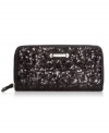 Every girl needs a little glamour on-the-go, and this shimmery sequin-embellished wallet from Nine West is the perfect choice. The slim design discretely slips into your bag, while plenty of interior pockets safely stow cards, cash, coins and ID without a worry.