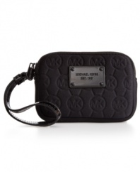 Pack up your absolute essentials and head out the door with this adorable design from MICHAEL by MICHAEL Kors. The undecidedly soft neoprene is dressed up in a signature-embossed pattern with slim wristlet strap. Easily fits cash, cards, phone and favorite lipstick.