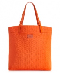 Add a pop of color to your summer wardrobe with this take-anywhere tote from MICHAEL by Michael Kors. The ultra-soft neoprene is dressed to impress in a signature-embossed circle pattern, while the generous interior provides pockets and compartments for your little favorites.