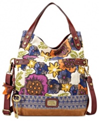 Every look needs a little laid-back luxe and this take-anywhere tote from Fossil is the perfect choice. Rich Italian leather and classic brass-tone hardware accentuate the colorful floral canvas, while plenty of pockets organize the interior.