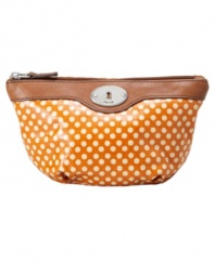Fossil's dome cosmetic case comes in fun color combos, in easy-to-clean coated canvas.