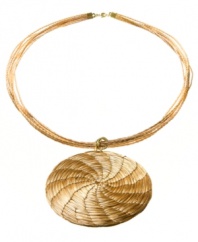 Through the use of indigenous fiber materials like buri and organic golden grass, found only in Brasil, Art da Terra creates handcrafted costume and fashion jewelry and handbags. The technique of intertwining golden grass, natural fibers and textiles into intricate designs by hand adds distinctive character to Art da Terra's creations. Own a piece of Brasil with this circle pendant necklace made from golden straw found in the Amazon. Discover Brasil. The bold colors. The exotic scents. The sensual textures. The natural sensations. Only at Macy's.