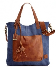 The everyday tote reaches a whole new level with this eye-catching design from Frye. A casual canvas exterior is accented with rich leather detailing and an optional crossbody strap, perfect for a weekend roaming around the city.