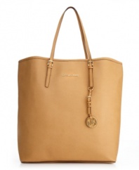 Whether jet-setting around the world or navigating through the concrete jungle, this sleek leather style from MICHAEL Michael Kors will help you do it in style. A take-anywhere tote silhouette accented with 18K gold hardware and a signature logo at front.