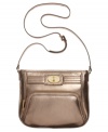 Make a move to metallic and give you're look an instant update with this compact crossbody from Calvin Klein. Soft, supple leather is finished with detail stitching and golden turnlock accent, while zipped compartments inside and out keep your essentials safe and secure.