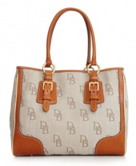 A signature style from Dooney & Bourke that will add an elegant touch to any outfit. A spacious design with classic detailing is a must-have for every girl's designer handbag collection.