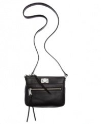 Simplistically chic with just enough shine. This luxurious leather crossbody from Calvin Klein gives you on-the-go style with glistening hardware and conveniently placed pockets.