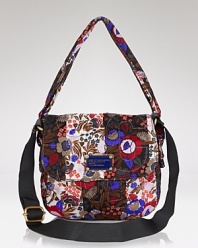 Decorate every look with this printed floral bag from MARC BY MARC JACOBS. The simple silhouette exudes a casual elegance but it's the wallpaper pattern that really punches things up.