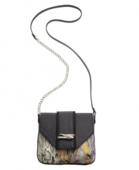 Sleek, chic and ultra-eniticing. The Serpent Crossbody from Rachel Rachel Roy features python print detailing and daring silvertone snake hardware at front. A chain detailed strap perfectly completes this alluring crossbody design.