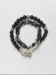 Double-strand beaded and link bracelet of sterling silver and black onyx is offset by an engraved lobster clasp.Sterling silver/stainless steelBlack onyxAbout 3 diam.Imported