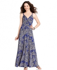 Polished paisley gets chic with this flowing petite maxi dress from NY Collection. Knotted shoulder straps and an alluring keyhole back give this look dramatic flair.