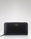 Sleek and sophisticated, this leather wallet from kate spade new york is a chic place to keep cash.