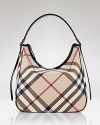 Exude uptown chic with this classic hobo style in Burberry's famous check.