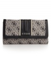 Find your signature style with this everyday essential from GUESS. This slim clutch design has a place for all your necessities from cards to cash. Carry it alone, or in your favorite GUESS purse to keep you organized all day and night long.