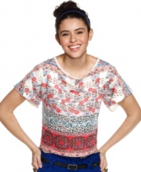 Add perforated cool to your stock of cute tops with this mixed print top that boasts holes galore!