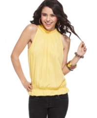 A high, ruffled neckline and flattering blouson fit make this top from Planet Gold a delightful match to your skinny jeans!