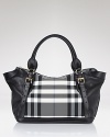 A bold black and white check panel lends statement style to this go-anywhere tote from Burberry.
