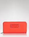 Practical accessories have a place in every it-girl's purse. But in a vivid hue, this croc-embossed rubber from MARC BY MARC JACOBS is almost too chic to keep inside.
