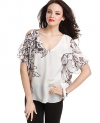 Shoulder cutouts offer the world a peek of skin, while light-as-a-feather silk creates a billowy silhouette on this femme and sophisticated top from GUESS?.