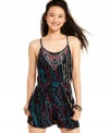 Tribal-inspired embroidery is superimposed over a rich, contrasting print on the perfect, hot-weather romper from Angie!