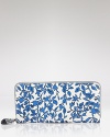 Compact style goes bold with this printed wallet from DIANE von FURSTENBERG. In the brand's signature graphics, this practical piece is almost too pretty to hide inside your purse.