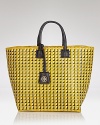 Park Avenue style goes bohemian with this woven straw tote from Tory Burch. In perfect step with the textured trend, it's as chic with pearls as it is with a printed maxi dress.
