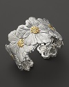 Delicate gardenias, captured at the height of their beauty in sterling silver and 18K yellow gold, bloom on this bracelet from Buccellati.