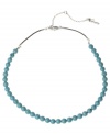 Add a subtle touch of color. Kenneth Cole New York's chic row of semi-precious turquoise beads is a winning addition to your collection. Set in silver tone mixed metal with a brown poly urethane cord. Approximate length: 18 inches + 3-inch extender.