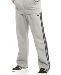 Warm up with these classic, yet soft as a feather, fleece pants from adidas.