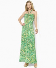 A vibrant sweeping pattern enlivens a breezy petite maxi dress, rendered in sleek jersey with a halter neckline, from Lauren by Ralph Lauren.