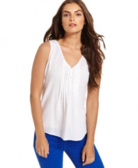 Brighten up for summer in Calvin Klein Jeans' must-have sleeveless petite tank top, made in an ultralight cotton fabric blend.