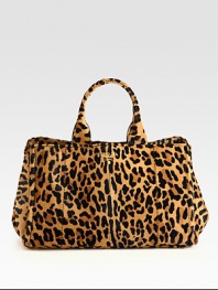 Leopard-print haircalf tote with hardware logo detail.Double top handles, 7 dropOpen topMagnetic snap gussetsProtective metal feetTwo inside zip pocketsThree inside open pocketsSignature jacquard lining16W X 10H X 10DMade in Italy