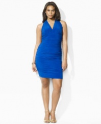 Rendered in luxurious matte jersey, a plus size cocktail dress is designed with elegant ruching along the bodice for a glamorous draping effect, from Lauren by Ralph Lauren.