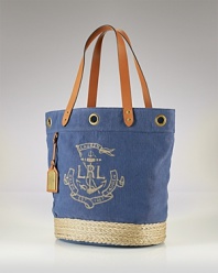Lauren Ralph Lauren is on board with daytime demands. This nautically-inspired tote boasts a straw trimmed design, sturdy leather trims and shoulder-right shape.